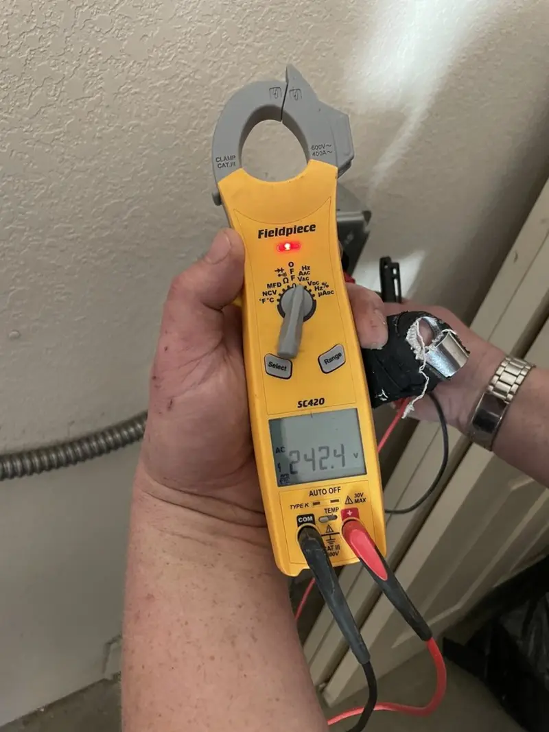 Voltage testing with clamp meter during Electrical Installation Services in Ansonia